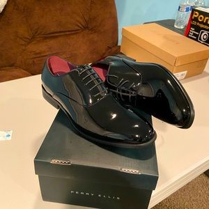 Perry Ellis dress shoes brand new with all original packaging.